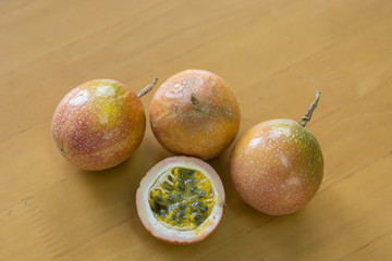 Ripe passion fruit on a wooden background