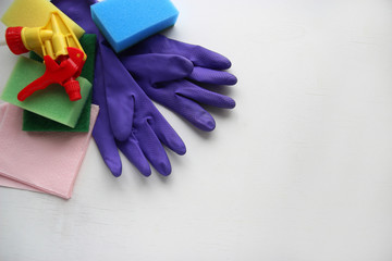 cleaning tools, rubber gloves, spray, sponge