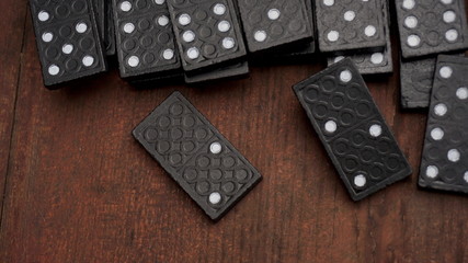 black dominoes on the table macro