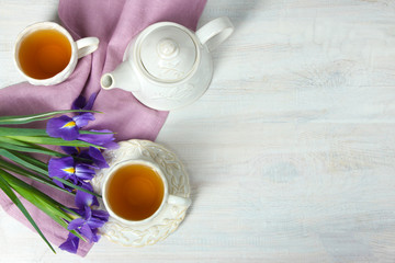 narcissus, cup with tea and teapot