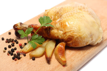 Grilled chicken with lemon on wood background