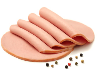 Sliced boiled ham sausage isolated on white background © Dmytro