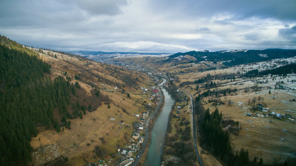 flying over the village in the mountains. aerial photography