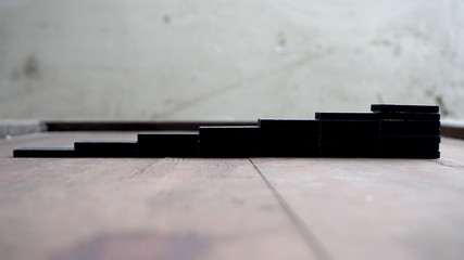 stairs of bones blask domino on the background © taraskobryn