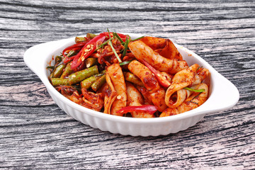 Spicy fried cowpea and squid with roasted chile paste.