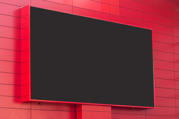 outdoor digital display on red wall - obrazy, fototapety, plakaty