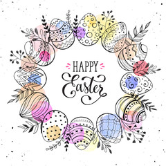 Easter wreath with hand drawn eggs and floral elements isolated on white background. Decorative frame from easter eggs with ornaments and watercolor spots  in circle shape.