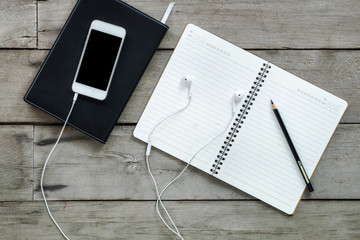 Fototapeta premium Top view, Education concept, Equipment and supplies for work on old wood background.