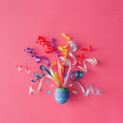 Egg with party streamers on pink background. Easter concept. Flat lay. - 140597992