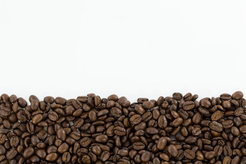 Coffee beans isolated on white background with copyspace for text. Coffee background or texture concept.