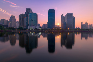 Fototapeta na wymiar Bangkok city with park with reflection of skyline at sunrise, Thailand.