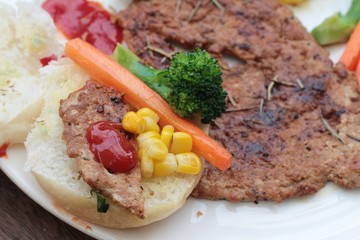 Grilled pork steak with  bread and ketchup.