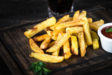 Fried potato with ketchup sauce and cola. Fast food menu.