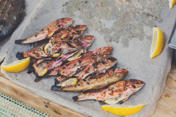 Seafood, mullet fish grilled at barbecue