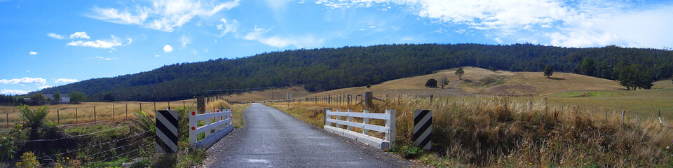 Gravel path crossing a Bridge leading to a Hillside