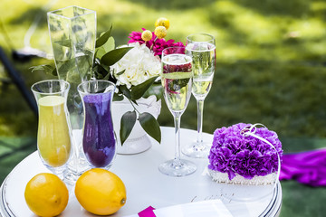 Small table with greeting album and wedding rings