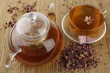 Tea made from rose petals in a glass teapot