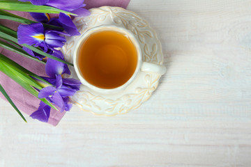 narcissus and a cup with tea