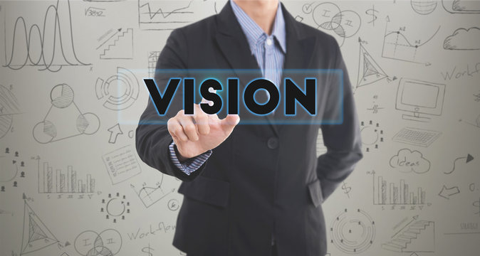 Businessman hand pressing wording key to vision. sign on virtual screen. can used for cover page presentation and web banner. business strategic concept.