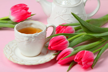 tulips,  teapot and a cup with tea