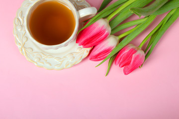 tulips and a cup with tea