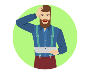 Hipster holding digital tablet PC and grabbed his head
