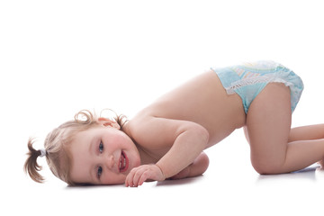 Obraz premium Baby girl wearing a diaper isolated on white