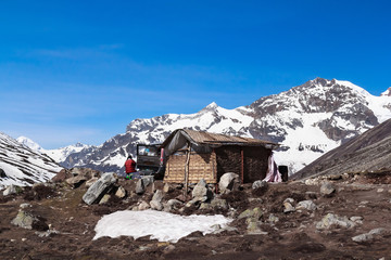 Little House And Jeep Snow Mountain Background Morning with Blue Sky in Zero Point Sikkim India - 140602959