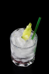 gin and tonic cocktail drink with nice garnish cucumber straw ice