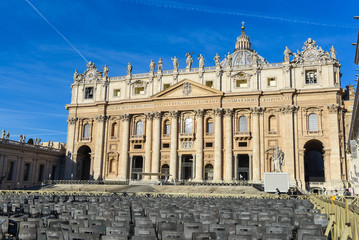 Fototapeta na wymiar St Peter square basilica facade and chairas