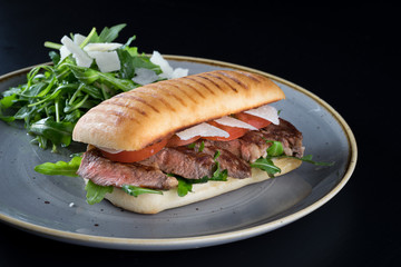 grilled steak medium fresh baked ciabatta sandwich beer