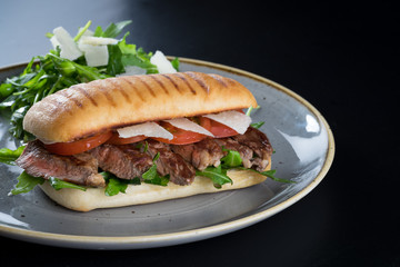grilled steak medium fresh baked ciabatta sandwich beer