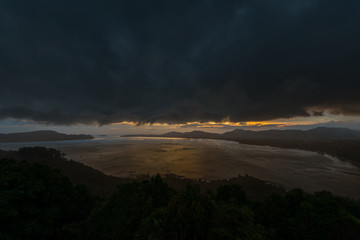 Kao Khad Viewpoint of Phuket city at sunset time with raincloud, Phuket, Thailand