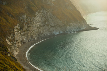 Fototapeta premium Jurassic coast showing secluded beach, with blue sea and white cliffs