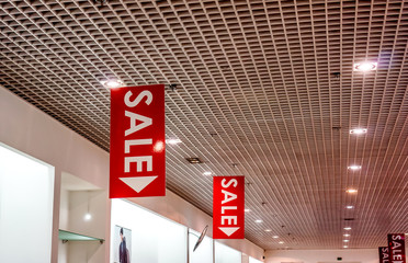 sale posters at fashion clothes shopfront