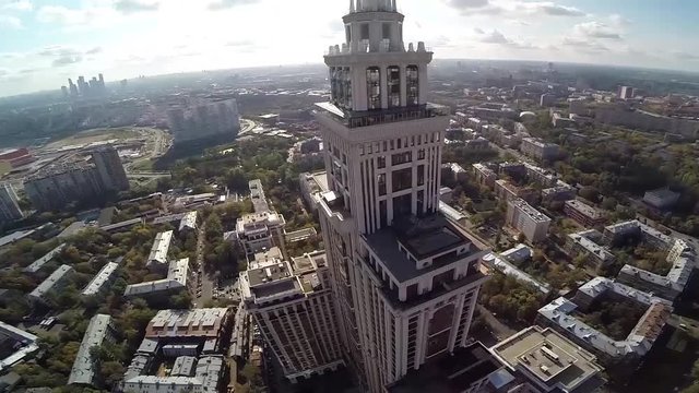 Aerial view of highest Moscow Building Triumph-Palace. Exterior of skyscraper Triumph-Palace against megalopolis at sunny day. House is tallest living building in Europe with high 264,5 meters.