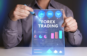 Business, Technology, Internet and network concept. Young businessman working on a virtual screen of the future and sees the inscription: Forex trading