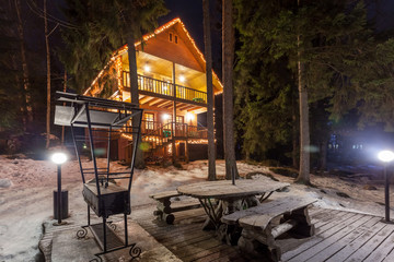 Obraz premium St.Petersburg, Russia - 04 March 2017: View of the illuminated cottages by the lake