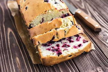 Homemade berry cake on rustic wooden background