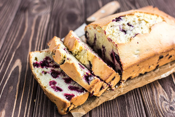 Homemade berry cake on rustic wooden background