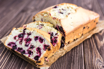 Homemade berry cake on rustic wooden background