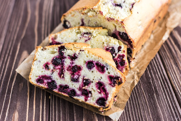 Homemade berry cake on rustic wooden background
