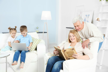 Grandchildren and grandparents at home