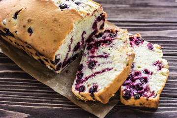 Homemade berry cake on rustic wooden background