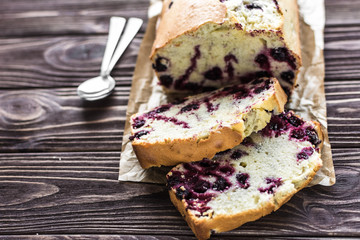 Homemade berry cake on rustic wooden background