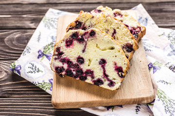 Homemade berry cake on rustic wooden background