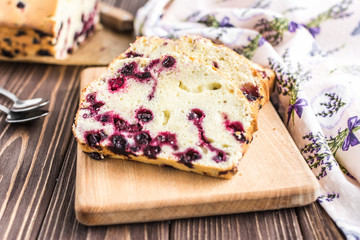 Homemade berry cake on rustic wooden background