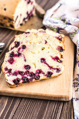 Homemade berry cake on rustic wooden background