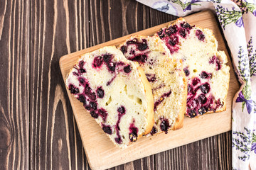 Homemade berry cake on rustic wooden background