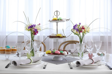 Beautiful Easter table setting in light room